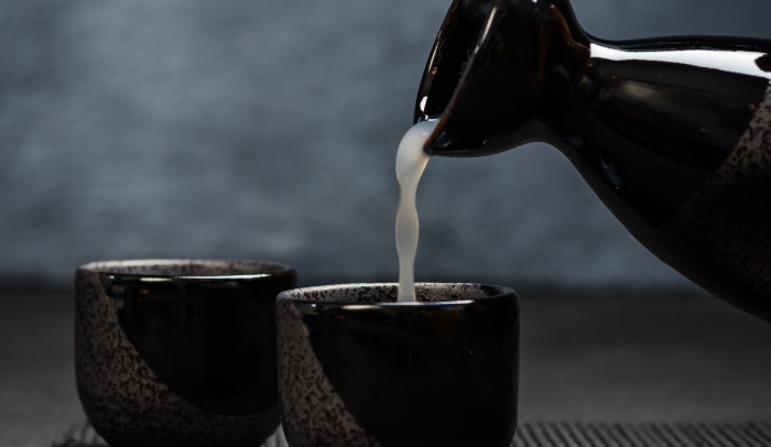 pouring-sake-into-sipping-ceramic-bowl-2021-08-26-16-37-24-utc